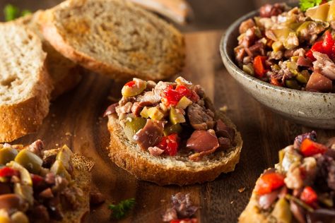 Black and Green Olive Tapenade Recipe | Epicurious Roasted Quince, Green Olive Tapenade, Olive Tapenade Recipe, French Appetizers, Tapenade Recipe, Table D Hote, Wolfgang Puck, Olive Tapenade, Toasted Bread