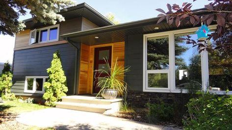 James Hardie Iron Gray on main level Mid Century Exterior, Hardie Siding, Outdoor Entryway, Cabin Doors, James Hardie, White Windows Exterior, Split Level Remodel Exterior, James Hardie Siding, Grey Siding