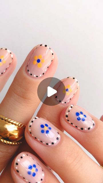 JASMIN on Instagram: "easy flower nail art repost from last summer 🌼  It wont get easier than this! The black and white outline was inspired by @onenailtorulethemall 🫶   Using black and white polishes from @mooncat*, blue from @shoreditchnailspolish* and yellow from @pleasing 🌻   Dotting tool from @picturepolish* 🔵🟡  Rings from @bohomoon 💍  *unpaid ad • gifted products  #nails #nailart #nailinspo #nailinspiration #naildesign #nailtrend #nailpolish #nailsofinstagram #nailsoftheday #nailsofig #nails💅 #nailsofinsta #nailsonfleek #nailsonpoint #nailtutorial #nailarttutorial #nailartvideo #nailvideo #easynails #dotticure easy diy Summer flower nail art tutorial short nails simple at home nail inspo for summer" Easy Nail Design With Dotting Tool, Easy Nail Art With Dotting Tool, Nail Art Using Dotting Tool, Dotting Tool Flower Nails, Easy Dot Flower Nail Art, Dot Nail Designs, Dotting Tool, White Polish, Nail Art Videos