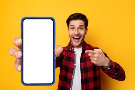 Excited guy pointing at black empty smar... | Premium Photo #Freepik #photo #showing-phone #phone #smartphone #mobile-mockup Guy On Phone, Man Holding Phone, Youtube Photo, Person Png, Graphic Pictures, Shop Counter Design, Mobile Frame, Thumbnails Youtube Background, Editing Images