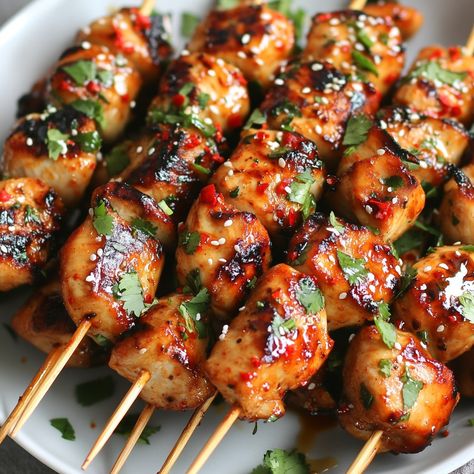 🍢 Spice up your meal with Sweet Chili Garlic Chicken Skewers! 🌶️ #GrillMaster #ChickenLovers Sweet Chili Garlic Chicken Skewers Ingredients: Chicken breast (500g, cubed) Sweet chili sauce (1/4 cup) Garlic (2 cloves, minced) Soy sauce (2 tbsp) Honey (1 tbsp) Lime juice (1 tbsp) Skewers Cilantro (for garnish) Instructions: Mix sweet chili sauce, garlic, soy sauce, honey, and lime juice for marinade. Marinate chicken for 30 minutes. Skewer chicken pieces. Grill until cooked through. Garnish ... Skewer Chicken, Chili Garlic Chicken, Garlic Chicken Skewers, Marinate Chicken, Instagram Recipes, Chicken Pieces, Chicken Skewers, Trending Recipes, Sweet Chili Sauce