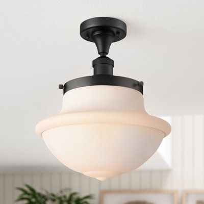 This 1-light semi flush mount adds a small boost of brightness to your kitchen or entryway. It's made from metal and features a simple socket with small riveting details for a hint of industrial design. A glass schoolhouse-shape shade caps the design and diffuses the light from your choice of bulb. We love how you can choose what kind of bulb is included. This fixture is compatible with a dimmer switch to effortlessly take you from day tonight. | Simple Semi Flush Mount in Matte Black Color w/ M Lite Brite, Light Fixtures Flush Mount, Beachcrest Home, Riveting, Edison Bulb, Semi Flush Mount, Dimmer Switch, Flush Mount Lighting, Flush Mount Ceiling Lights