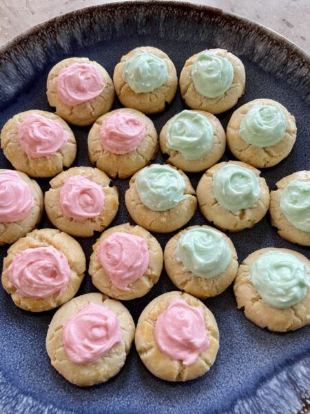 Thumbprints with Buttercream Frosting Thumbprint Cookies Buttercream, Thumbprint Cookies With Frosting, Almond Flavored Cookies, Crumbl Recipes, Thumbprint Cookies With Icing, Best Thumbprint Cookies, Flavored Cookies, Finger Desserts, Cookie Cake Pie