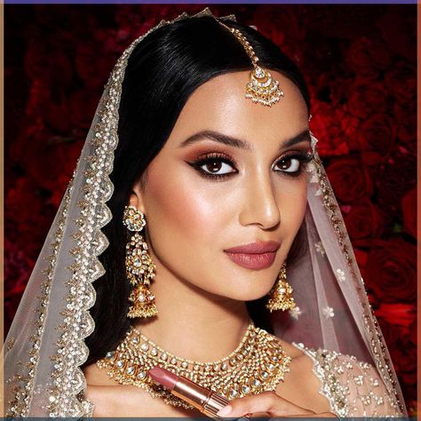 Darlings, my NEW ! Mesmerising Indian Wedding look is the perfect confidence-boosting kit for the glowing, hypnotic bride who lights up any room! Glamorous, beautiful and happy, she seduces with a glance! With sultry, golden eyes; flawlessly blushed cheeks and a dreamy, warm berry-pink lip, her look is made for days of dancing! Inspired by HOLLYWOOD GLAMOUR , CONFIDENCE and JOY , my Mesmerising Indian Wedding Look will empower you to be THE MOST BEAUTIFUL, CONFIDENT VERSION OF YOURSELF during yo Bridal Makeup Shoot, Indian Party Makeup, Bun Hairdo, Bridal Jewellery Ideas, Nude Makeup Look, India Makeup, Bride Fashion Photography, Amazing Makeup Transformation, Soft Makeup Look