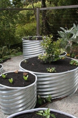 Metal culverts good idea for planters or outdoor seats. Roll edges to decrease sharp edges. Unique Raised Garden Beds, Inexpensive Raised Garden Beds, Raised Planters, Diy Garden Bed, Vegetable Garden Raised Beds, Building A Raised Garden, Diy Raised Garden, Raised Garden Beds Diy, Square Foot Gardening