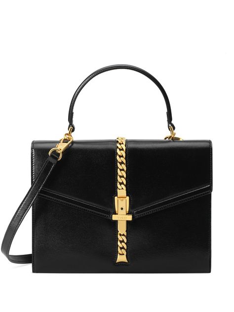 Time to meet your new BFF. This black leather small 1969 Sylvie tote bag from Gucci vows to be there…. Color:black. Material:Leather/Leather/Metal #adv womens #bags #totes #shoppers # Ysl Handbag, Small Top Handle Bag, Gucci Sylvie, Leopard Tote, Vintage Effect, Square Body, Designer Totes, Judith Leiber, Medium Tote