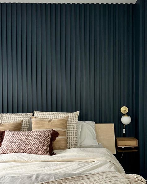 "{We love the depth and texture that this painted wood slated wall brings to the room. The vertical slats make the space looks so much bigger 😱 The clients wanted a color that would pop so we went with Newburyport Blue from @benjaminmoore and we absolutely love it! Check out our insta for the before of this room}" #customwoodwork #paintedwoodslatwall #woodslatedwall #bedroom #bedroomideas #details #accentwallideas Painted Wall Slats, Modern Slat Wall Bedroom, Painted Fluted Wall, Vertical Slat Accent Wall, Navy Slat Wall, Painted Wood Slat Wall, Accent Wall Vertical Wood, Slate Wall Bedroom, Wood Slated Wall