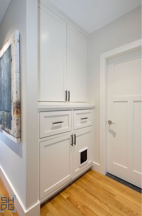 Storage built for the whole family, including your cat! Spot the cat door for a hidden litter box. #SlocumHallDesign #Storage #StorageSolutions #Cat #CatDoor #CreativeSolutions #InteriorDesign #Architecture #Boston #BostonDesign #BostonHomes #BostonArchitecture Laundry Room Ideas With Cat Litter, Cat Litter Box In Cabinet, Hidden Litter Robot, Litter Box Built In Cabinet, Cat Litter Box Ideas Hidden Cabinet, Cat Built In, Cat Litter Ideas Hidden, Cat Litter Robot Ideas Hidden, Built In Cat Litter Box Ideas