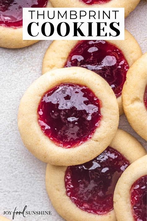 The best thumbprint cookies! In this thumbprint cookie recipe a 5-ingredient, buttery shortbread cookie is filled with your favorite jam for a delicious treat perfect for the holidays. Best Thumbprint Cookies, Cookies With Jam, Thumbprint Cookie, Christmas Cookie Recipes Holiday, Jam Thumbprint Cookies, Jelly Cookies, Thumbprint Cookies Recipe, Easy Christmas Cookie Recipes, Christmas Baking Recipes