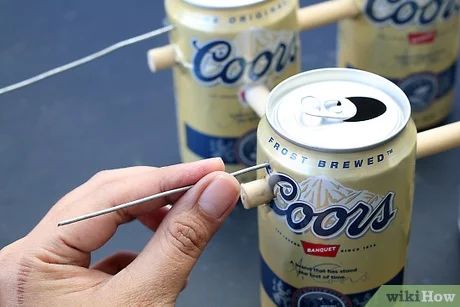 5 Ways to Make Beer Can Christmas Ornaments - wikiHow Beer Can Lights, Beer Can Christmas Decorations, Beer Christmas Ornaments Diy, Beer Can Wall Art, Beer Themed Christmas Decorations, Beer Can Christmas Ornaments, Beer Cans Crafts Ideas, Beer Can Crafts, Beer Crafts Diy