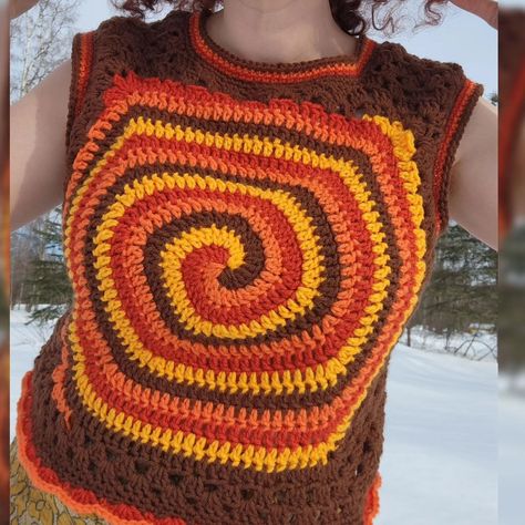 Fresh off the hook: ✨️🧡The 70's Spiral Granny Vest🧡✨️⬇️ I've been really into spirals lately, what can I say? This combination of the crochet spiral with the quintessential 70's granny square top is something I've been working on for a while now, and I'm really happy with how it turned out. Tester call coming so soon! 🌟 Oh and Happy Spring Equinox everybody, doesn't look much like spring behind me, Alaska has a couple more months with snow and ice before even one green leaf appears 😅🌬❄️❄️❄️... Granny Vest, Granny Square Top, Crochet Spiral, Off The Hook, Spring Equinox, What Can I Say, Square Top, Snow And Ice, Happy Spring