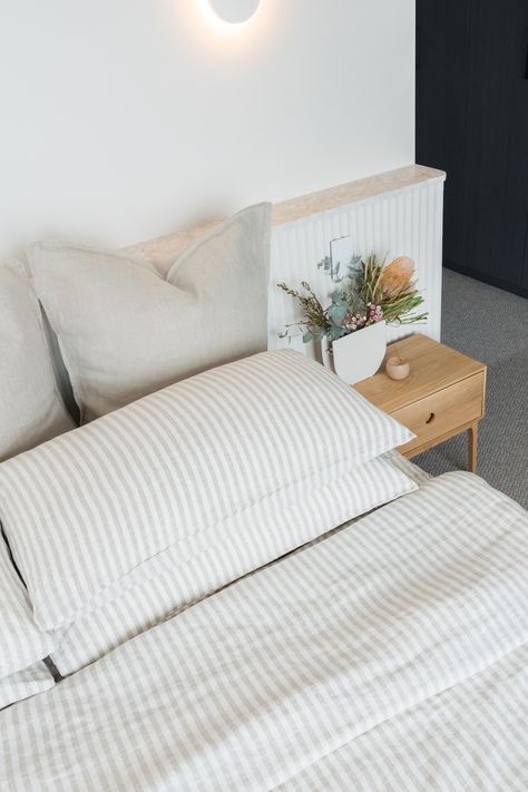 How to build a ledge wall: Convex and pink terrazzo shelf wall Built In Bedside Tables Master Bedrooms, Built In Bedside Tables, Behind Bed Shelf, Built In Bedhead, Bedroom Ledge, Pink Terrazzo Tile, Diy Ledge, Bedroom Wall Lights, Timber Bedside Table