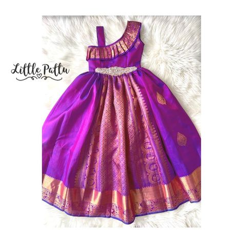 Little Pattu (Toronto, Canada) | Pure Kanchipuram purple with temple gold zari made in a one shoulder dress style!! Ask for your 1 shoulder kanchipuram dress | Instagram Pattu Dress For Kids, Pattu Frocks For Kids, Small Girls Dress, Kids Saree, Traditional Baby Dresses, Baby Lehenga, Frock Models, Pattu Langa, Baby Dress Embroidery