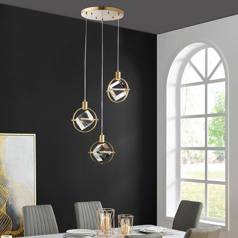 The "Hollywood 3 Light Pendant" is a stylish and elegant chandelier that is sure to add a touch of glamour to any room. The fixture features a gleaming gold finish and is dimmable, allowing you to adjust the ambiance to your liking. 3 Light Pendant, Modern Wall Sconces, Clock Decor, Acrylic Mirror, Hanging Pendant Lights, Modern Pendant Light, Dining Room Living Room, Pendant Gold, Modern Pendant