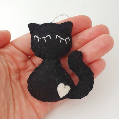 Purr-fectly adorable and a little bit sleepy 😴🐾 Meet our felt black cat ornament, designed with a cozy, sleepy face that’s sure to melt your heart! This little feline friend is the perfect addition to your seasonal décor, or a thoughtful gift for any cat lover. Handmade with soft felt, it's the ideal blend of cute and comfy for your home. Grab yours now and let this sleepy kitty add a touch of warmth to your space! 🐱🖤 🔗 Shop link in bio! #CatLovers #FeltCrafts #BlackCatMagic #SleepyKitty #Ha... Sleepy Face, Sleepy Kitty, Felt Decorations, Sleepy Cat, Cat Ornament, Cozy Decor, Handmade Felt, Felt Ornaments, Handmade Ornaments