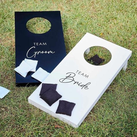 Have some fun with this cornhole wedding day game on your special day. 🤍🖤 It’s the perfect way to get the party started with your wedding guests! #weddingday #weddinggames #cornhole #cornholeboards #bridevsgroom #lawngames #gardenparty #wedding #weddinginspiration #weddinggarden #weddingideas Yard Games For Wedding Receptions, Wedding Outdoor Activities, Backyard Wedding Cornhole, Modern Rustic Wedding Decor Receptions, Games For Market Day, Cornhole For Wedding, Wedding Activities For Guests Indoor, Mr And Mrs Cornhole Boards, Summer Wedding Activities