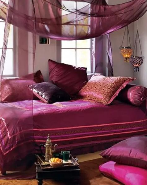 a bold purple and fuchsia bedroom with airy and sheer textiles, lanterns and a low table Bedroom Ideas Moroccan Style, Black Room Theme, Middle Eastern Bedroom, Purple Bedroom Wall, Dekorasi Maroko, Moroccan Style Bedroom, Bohemian Bedrooms, Canopy Bed Diy, Design Marocain