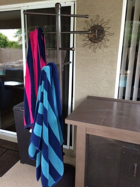 With great pool comes great towel mess! This is a simple DIY project that uses inexpensive PVC pipe, a few screws and a shade umbrella stand to make a very practical towel tree for summertime poolside organization. I think it took me all of an hour, maybe two, to assemble and paint. Total cost, a hair over $50. If you don't paint it, less than $50. Pool Towel Rack Diy, Pvc Pool Towel Rack, Poolside Towel Rack, Pvc Towel Rack, Outdoor Towel Rack, Pool Towel Holders, Towel Rack Pool, Pvc Pool, Diy Towel Rack