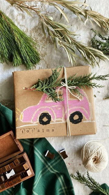 Laura Prietto on Instagram: "Gift Wrap with Greenery - Part 3 🌲 A classic car carrying a tree is the final idea in my series. I hope you’ve enjoyed different ways to use pine clippings when wrapping presents! Thank you to my crafty friends @hyokim_crafts & @golden_freckles for this inspo ✨🚗🎄 . . . #diygiftwrap #naturecrafts #wrapitupchallenge#christmascrafts #sustainablegiftwrap #recyclemeplay #fantasyhasreallynolimits#homeschooldailyapple #ministylemag #averycardboardchristmas" Cheeseboard Gift Wrapping, 2024 Holidays, Diy Holiday Gift Wrapping, Natural Gift Wrapping, Christmas Gift Wrapping Diy, Christmas Present Wrap, Sustainable Gift Wrap, Wrapping Presents, Instagram Gift