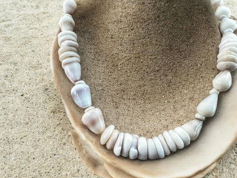 Dwarf Cone Shell & Puka Shell Necklace 🐚 Crafted from ethically and lovingly collected Hawaiian shells in a mix of whites, creams, purples, & peaches. Available in my Of The Sea & Collection. • • #pukashellnecklace #coneshell #shellsofhawaii #pukashells #handmadejewelry Cone Shell, Puka Shell Necklace, Puka Shell, Necklace Craft, Shell Necklace, Shell Necklaces, Peaches, The Sea, Shells