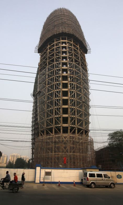 Daring #Architecture or giant Monstrosities? Ridiculous buildings that are popping up all over #China  (This construction for 'People's Daily', the official mouthpiece of the Chinese ruling party with its phallic-like connotation, has become an object of ridicule among Chinese citizens.) Unrealistic Architecture, Giant Architecture, Oppressive Architecture, Unsettling Architecture, Inverted Pyramid Architecture, Southern House Plans, Lake House Plans, Space Place, Chinese Architecture