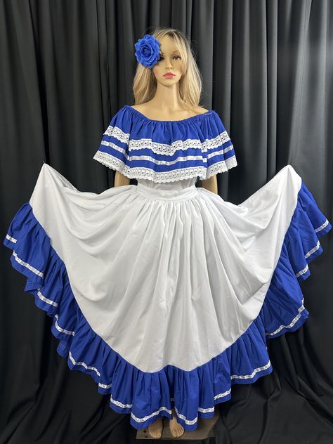 "This stunning Dancing Wide Long Dress can be purchased online through our official website or through authorized retailers. - Brand Name: Our brand name is \"Latin Expressions\" - a tribute to the vibrant and rich cultures of El Salvador, Honduras, and Nicaragua. - Keywords: Dancing Wide Long Dress, vibrant culture, El Salvador, Honduras, Nicaragua, blouse, high-quality fabric, Dacron Poly/Cotton blend, elastic opening, XL size, comfortable fit, Poplib Poly/Cotton blend, satin ribbon, cotton la El Salvador Traditional Dress, Salvadorian Culture, Folklorico Dresses, Aztec Clothing, Dancing Skirt, Dancing Dress, National Costume, Hispanic Heritage, Dance Dresses