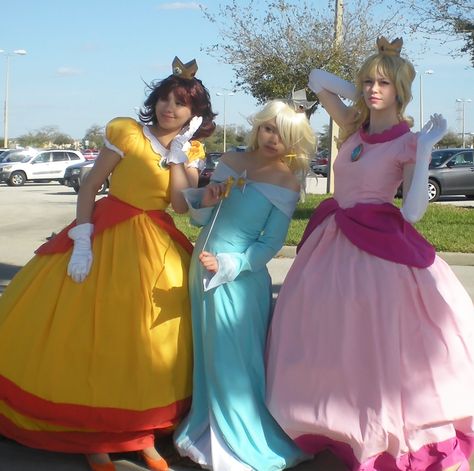 Mario Princess Costumes Pauline Costume Mario, Princess From Mario Costume, Plus Size Princess Peach Costume Diy, Mario Princesses Cosplay, Peach And Daisy Cosplay, Peach And Rosalina Costume, Peach Daisy And Rosalina Costume, Trio Cosplay Ideas Anime, Nintendo Halloween Costumes