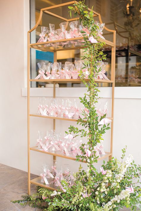 Wedding favor display Courtyard Wedding Reception, Wedding Favor Display, Mendoza Wedding, Romantic Courtyard, Paper Crane Wedding, Elegant Wedding Design, Favor Display, Gold Shelf, Downtown Santa Barbara