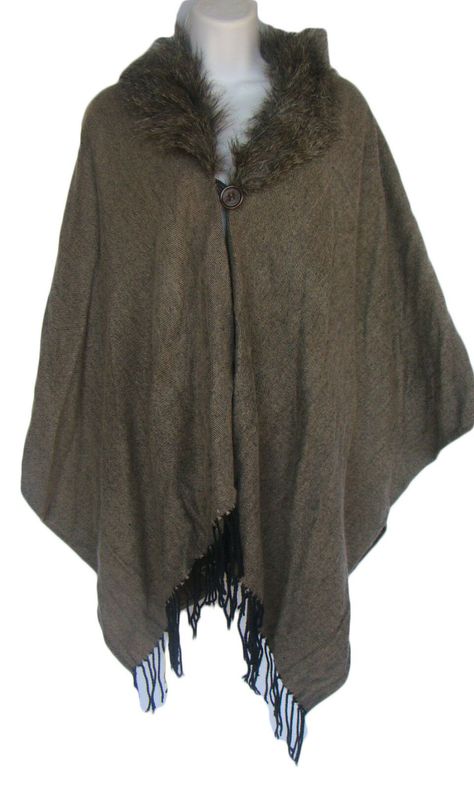 This cape is new with tags. Brown with faux fur trim. Fringed in the front. One button closure. The size is O/S . Very generous bust, 27" - 33" in length. 100% acrylic. Medieval Fur Cloak, Kermit Memes, Dark Planet, Fur Poncho, Fur Cape, Earthy Outfits, Shadow Box Art, Fairy Clothes, Fur Shawl