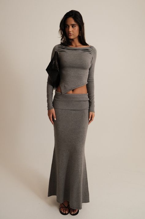 Winter bliss.Elevate your wardrobe with the KARLIE Knit Maxi Skirt, a timeless piece designed for both elegance and comfort. Featuring a mid-rise waist and a sleek hip overlay, this skirt effortlessly flatters your silhouette. The maxi length and fishtail hem add a touch of sophistication, making it perfect for any occasion. Crafted from a soft, unlined knit, the Karlie Knit Maxi Skirt ensures a comfortable fit while maintaining a chic and polished look. For a complete ensemble, pair it with the Karlie Off Shoulder Knit Top and step out in effortless style. Capsule Wardrobe Accessories, European Summer Outfits, Knit Maxi Skirt, Wardrobe Accessories, Maxi Dress Sale, Capsule Outfits, Knit Skirt, Lookbook Outfits, Polished Look