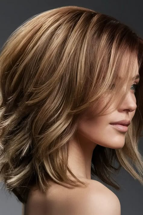 Woman with shoulder-length, layered brown hair styled with loose waves. Light Light Brown Hair, Dirty Blonde Hair With Highlights, Dark Blonde Hair Color Ideas, Auburn Blonde Hair, Honey Brown Hair Color, Brunette With Blonde Highlights, Natural Dark Blonde, Dark Blonde Highlights, 2024 Hairstyles