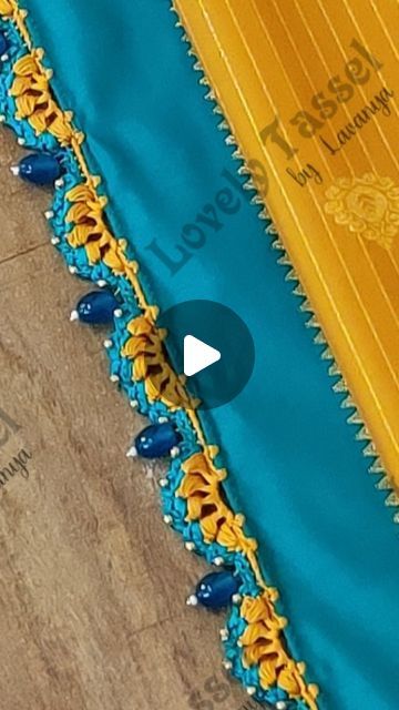 Lavanya Boganatham on Instagram: "Saree Tassel Work with Crochet Puff Stitch & Glass beads ✨ Notes👇
•6 strands of silk thread
•crochet needle no.10
•Step 1 - 2 chains, 5 chains, 2 chains, 5 chains...
•Step 2 - 5 puff stitch in first 5 chain gap, 4 SC in 2nd 5 chain gap (2 chain gap to be left blank)
•Step 3 - 1 chain, add small bead, 1 chain, 1 DC, 1 lock after each puff stitch
2 SC, add glass bead, 2 SC after every arch
•Happy Tasseling 😊 Thank you 🙏
.
.
.
#lovelytassel #saree #sareetassel 
#sareekuchulu #sareekuchu #kuchulu 
#tassels #kuchu #weddingsarees 
#connection #creation #focus #threadwork 
#instareels #sareepalluhangings #sareetassels 
#handcrafted #handmade #creative
#silksarees #instaengagement #india #fashion 
#artwork #trendingreels #sareekuchudesign #viral #bengaluru" Crochet Saree, Saree Kuchu Design, Tassels For Saree, Saree Kuchulu, Saree Pallu Kuchulu Designs, Latest Saree Kuchu Designs Tassels, Krosha Kuchu Designs Saree, Krishne Saree Kuchu Tassels, Saree Kongu Kuchulu