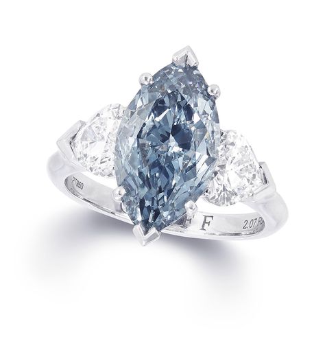 Graff marquise-cut blue centre diamond ring featuring two white diamonds. Graff Engagement Ring, Engagement Ring Blue Stone, Graff Jewelry, Graff Diamonds, Blue Diamond Engagement Ring, Blue Day, Blue Diamond Ring, Bridal Accessories Jewelry, Jewelry Model