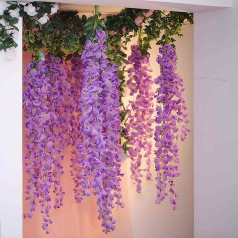 [About] Quantity: 1 Hanging Garland with 5 Strands (3 long + 2 Short) Flower Type: Wisteria Material: Silk Color: Lavender Overall Garland Length: 42" | 3.5 Ft with Stem Short Strand height: 28'' Short Strand (Flower Only): 25" Long Strand Length: 37" Long Strand (Flower Only): 35" Garland Width: 9" [Information] Additional Information: No. of Petals on Short Strand: 62-65 No. of Petals on Long Strand: 92-95 Petal Size: 1.5" Total Leaves: 28 Pcs (4 stems of 7 leaves) 3 different Leaf Sizes: 3"x1 Poppy Flower Bouquet, Hanging Flower Garland, Hanging Wisteria, Wisteria Vines, Wisteria Vine, Wisteria Flower, Hanging Vines, Deb Dresses, Rose Stem