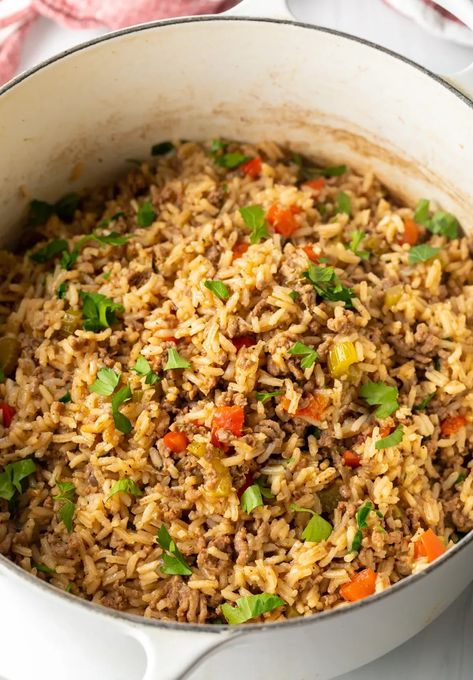 How to Make Dirty Rice - This classic Cajun recipe features ground beef, veggies, and lots of vibrant spices. It's a one-pot dish that's deliciously zesty, comforting, and great to serve as a main or side! Start to finish you need only 40 minutes to make this authentic Creole dinner any night of the week. Ground Beef Dirty Rice, Zatarains Dirty Rice Recipe, Pappadeaux Dirty Rice Recipe, Dirty Rice Recipe With Ground Beef, Dirty Rice With Ground Beef, Cajun Dirty Rice Recipe, Cajun Rice Recipe, Grilled Ham Steaks, Cajun Dirty Rice