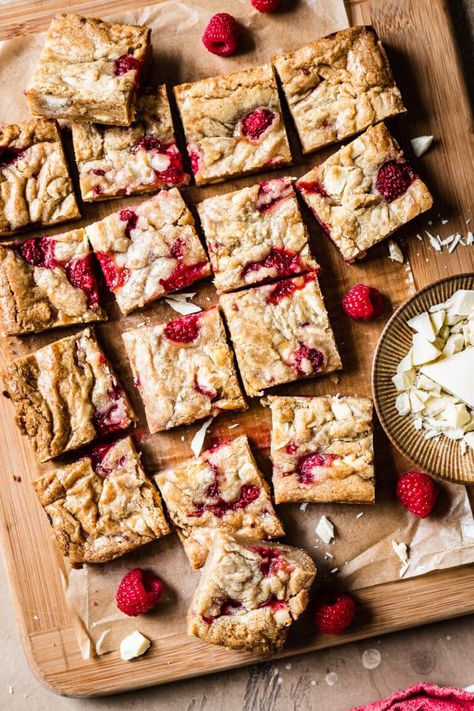 These chewy, densely fudgy raspberry and white chocolate blondies are packed with white chocolate chunks and studded with tangy bites of raspberry. They have a beautiful shiny top and rich, buttery flavor that bakes into a toasty, caramelized bottom and edges. It's a very easy cookie recipe with a batter you can mix together in minutes. The hardest part is waiting for these blondies to cool! Easily substitute frozen raspberries to enjoy these decadent bars whenever you have the urge. Very Easy Cookie Recipe, Raspberry And White Chocolate, Chocolate Blondies, White Chocolate Blondies, Frozen Raspberries, White Chocolate Bar, White Chocolate Raspberry, Port Wine, Baking Blog