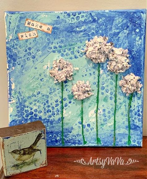 I love mixed media art projects. This one is fun and easy enough for any age. And, while you're at it, you're recycling paper from your shredder!I started by adding 3 colors of Dixie Belle Paint to a 12" x 12" canvas. I used the colors Mermaid Tail, Sea Glass, & Haint Blue. Acrylic paint would work great for this project too. I used an old hotel key card to spread the paint around on the canvas. Don't overwork it or you'll just mix the colors together & get one color. While the can… Diy Mixed Media Art, Bubble Wrap Art, Art From Recycled Materials, One Is Fun, Recycling Paper, Hotel Key Cards, Haint Blue, Altered Canvas, Mixed Media Art Projects