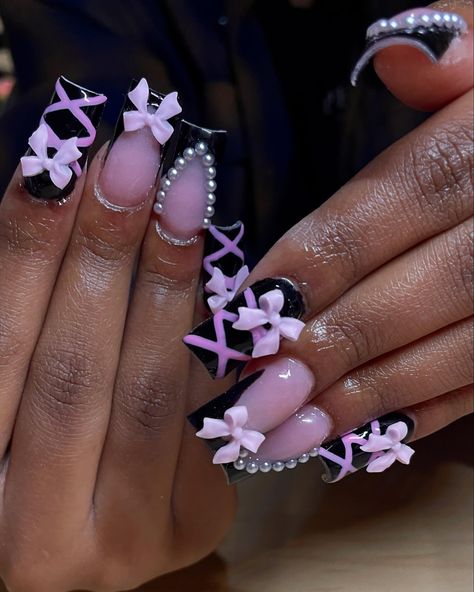 Pretty in pink and black with a twist 🎀✨ I had the best time with this girly she was so fun 🖤 Follow @carmenz.clawz for more • • • • • #nailtech #coquette #coquettenails #edgynails #blacknails #pinknails #blackandpink #girlynails #bows #cutenails #acrylicnails #mediumnails💅 #beginnernails #3dnails #frenchtips #classynaildesign #nailsofinstagram #dailynailsfeed #girlygirl #pearls #pearlnails #carmenzclawz Pink And Black Nails With Charms, Black And Pink Christmas Nails, Short Pink And Black Nails, Nails With Bows On Them, Light Pink And Black Nails, Pink And Black Nails, Classy Nail Designs, Edgy Nails, Pearl Nails