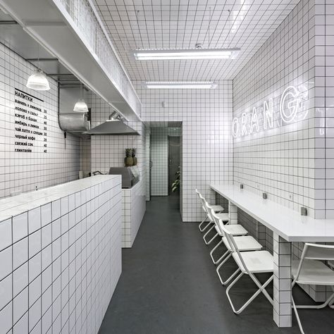 Ukrainian studio AKZ Architectura has completed this vegetarian cafe in Kiev, covering the interior in white tiles and installing a "jungle" in the toilets Interior Design Blogs, Sandwich Bar, White Ceramic Tiles, H Design, Wallpaper Magazine, Bar Interior, Minimalism Interior, White Tiles, Restaurant Interior