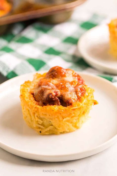 If you're looking to add a new twist to your spaghetti squash recipes try these low carb spaghetti squash nests. Top with spaghetti sauce, meatballs, pesto, or even an egg! They're versatile and delicious! After slicing your spaghetti squash in half and scooping out the seeds place the squash in a 9×13 dish and pour 1 cup of water in the bottom.Rub a little olive oil and sea salt and pepper with your hands over the inside of the squash.Place the squash face sized down into the wat… Spaghetti Squash Nests, Pressure Cooker Meatballs, Low Carb Spaghetti Squash, Chicken Fried Cauliflower Rice, Low Carb Spaghetti, Veggie Meatballs, Easy Waffle Recipe, Baked Teriyaki Chicken, Pork Chops And Gravy