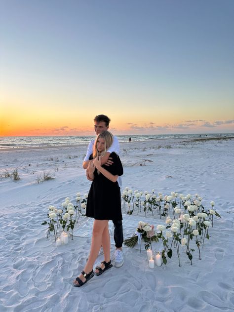 Beach Flower Proposal, Flowers In Sand Proposal, Beach Proposal White Roses, Sunset Beach Proposal Ideas, Proposal Ideas White Roses, Sunrise Beach Proposal, Dream Proposal Beach, Winter Beach Proposal, Intimate Beach Proposal