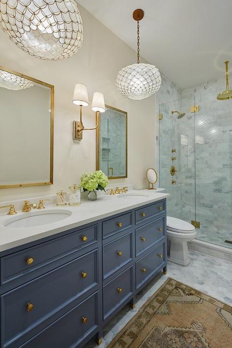 This elegant bathroom features a Hulton Double Sconce mounted between Restoration Hardware Industrial Rivet Mirrors hung above a blue dual washstand accented with brass knobs and a white quartz countertop finished with antique brass faucets. Old Bathroom Remodel, Old Bathroom, Cheap Bathrooms, Gold Fixtures, Bad Inspiration, Floor Remodel, Home Luxury, Trendy Bathroom, Blue Bathroom