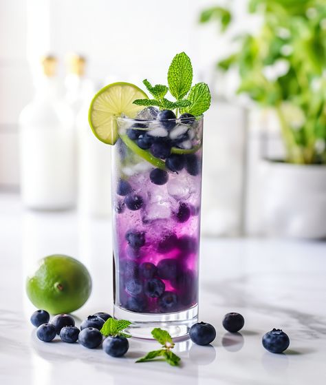 Blueberry mojito Blueberry Mojito, Blueberry Mint, Cocktail Umbrellas, Popular Cocktails, Nugget Ice Maker, Nut Free Recipes, Blueberry Juice, Colorful Cocktails, Mojito Recipe