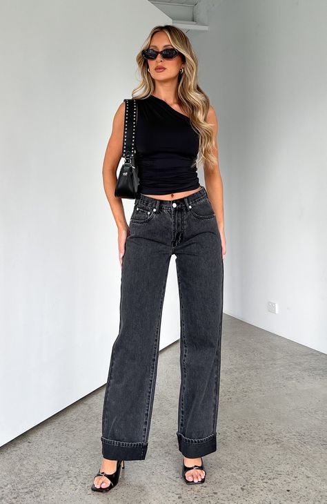 Feel like the best version of yourself in the Always Be Yourself Low Rise Straight Leg Jeans Black Acid Wash. These low rise, relaxed fit jeans feature wide leg style, silver button closure, folded cuff hem design & zip at front, belt loops and 5 pocket design. We love this paired with a cute crop and sneakers for the perfect weekend look!  - 100% Cotton - Em is 171cm & is wearing an XS - Ash is 166cm & is wearing an XS