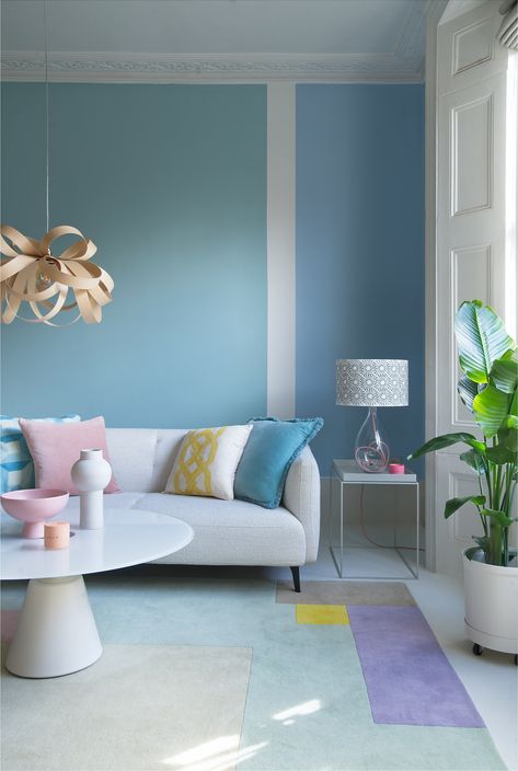 When you can't decide on one colour for your living room - pick two! We’ve teamed up with Albany, who have over 100 years of expertise, to create a stunning range of 70 beautiful classic and contemporary shades. Albany paint is already a firm favourite among professional and amateur decorators for providing a high-quality finish. We’ve sprinkled a little extra Ideal Home magic over it to create a range that we hope you’ll love as much as we do. Tan Living Room, Room Wall Painting, Wall Paint Designs, Room Paint Colors, Blue Living Room, Paint Colors For Living Room, Design Del Prodotto, Beautiful Living Rooms, Living Room Paint