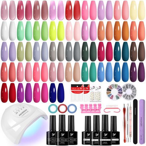 PRICES MAY VARY. [PHOENIXY Gel Nail Polish Kit with Nail Lamp]: 40 colors 7ml gel nail polish, 2 pcs 7ml base coat, 7ml top coat, 7ml matte top coat, nail decorations and other manicure tools. A cost-effective kit for manicure beginners and lovers. With some practice, you can get beautiful nail art for all seasons and occasions- parties, holidays, work or daily life. [High Quality & Long Lasting]: Made of natural resin, Phoenixy gel nail polish contains botanical ingredients and lowest smell, ha Amazon Gel Nail Kit, Gel X Kit, Gel Nail Products, Gell Nails, Best Nail Polish Brands, Gel Nail Set, Christmas Lists, Nail Kits, Gel Nail Polish Colors