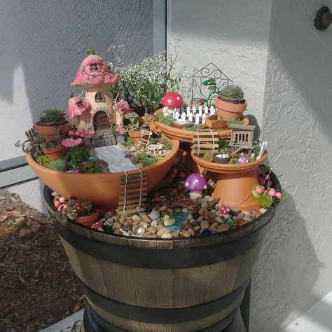 Front Porch Fairy Garden, Multi Level Fairy Garden, Fairy Gardens In A Pot, Potted Fairy Garden Ideas, Tiered Fairy Garden, Fair Garden Ideas Diy, Container Fairy Garden Ideas, Gnome Village Ideas, Small Fairy Garden Ideas