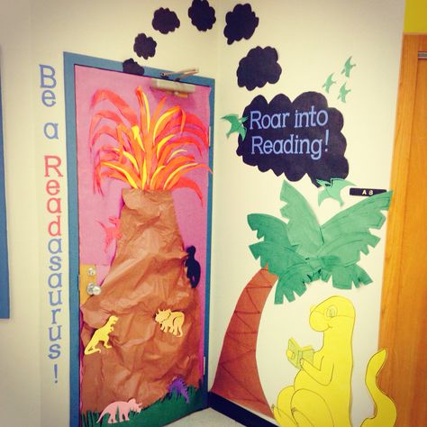 Dinosaur themed door for classroom Door For Classroom, Dinosaur Bulletin Boards, Dino Activities, Dinosaur Classroom, Preschool Library, Book Fairs, Dino Theme, Dinosaurs Preschool, Library Themes