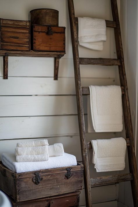 31 Farmhouse Bathroom Ideas to Freshen up Your Space Farmhouse Bathroom Towel Hooks, Basic Farmhouse, Rustic Sinks, Primitive Bathroom Decor, Wooden Ladders, Primitive Bathroom, Rustic Sink, Beadboard Wainscoting, Towel Ideas