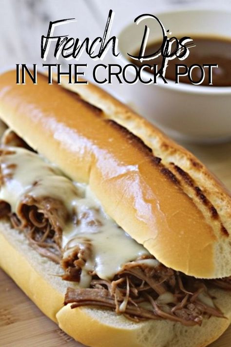 french dips in the crockpot written with a picture of a hot beef french dip sandwich with homemade au jus sauce in the background French Onion Soup Cheese, Crockpot French Dip, Crock Pot French Dip Sandwiches, Crock Pot French Dip, Chuck Roast Crock Pot Recipes, French Dip Sandwich Crockpot, Slow Cooker French Dip, French Dip Recipes, French Dip Crock Pot